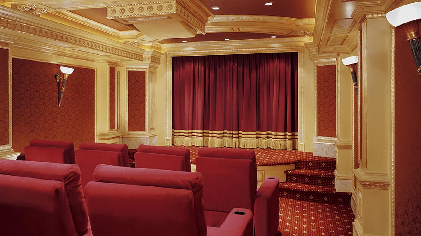 AcousticSmart CEDIA award winning movie palace theater with gilded ceiling and burgundy curtain