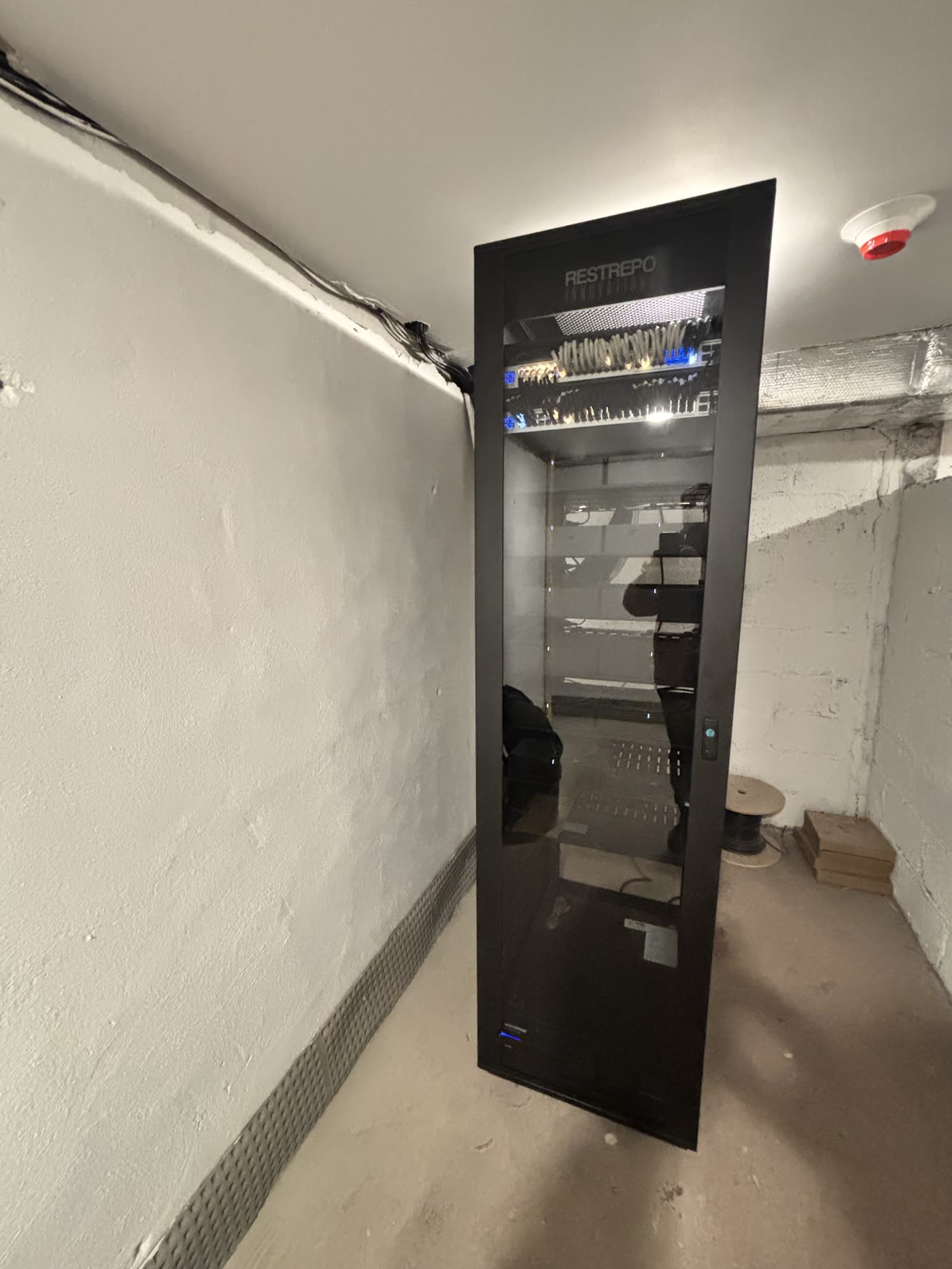 Interior of the 50 Summit rack with WattBox power management, network gear, and patch panels documented for service
