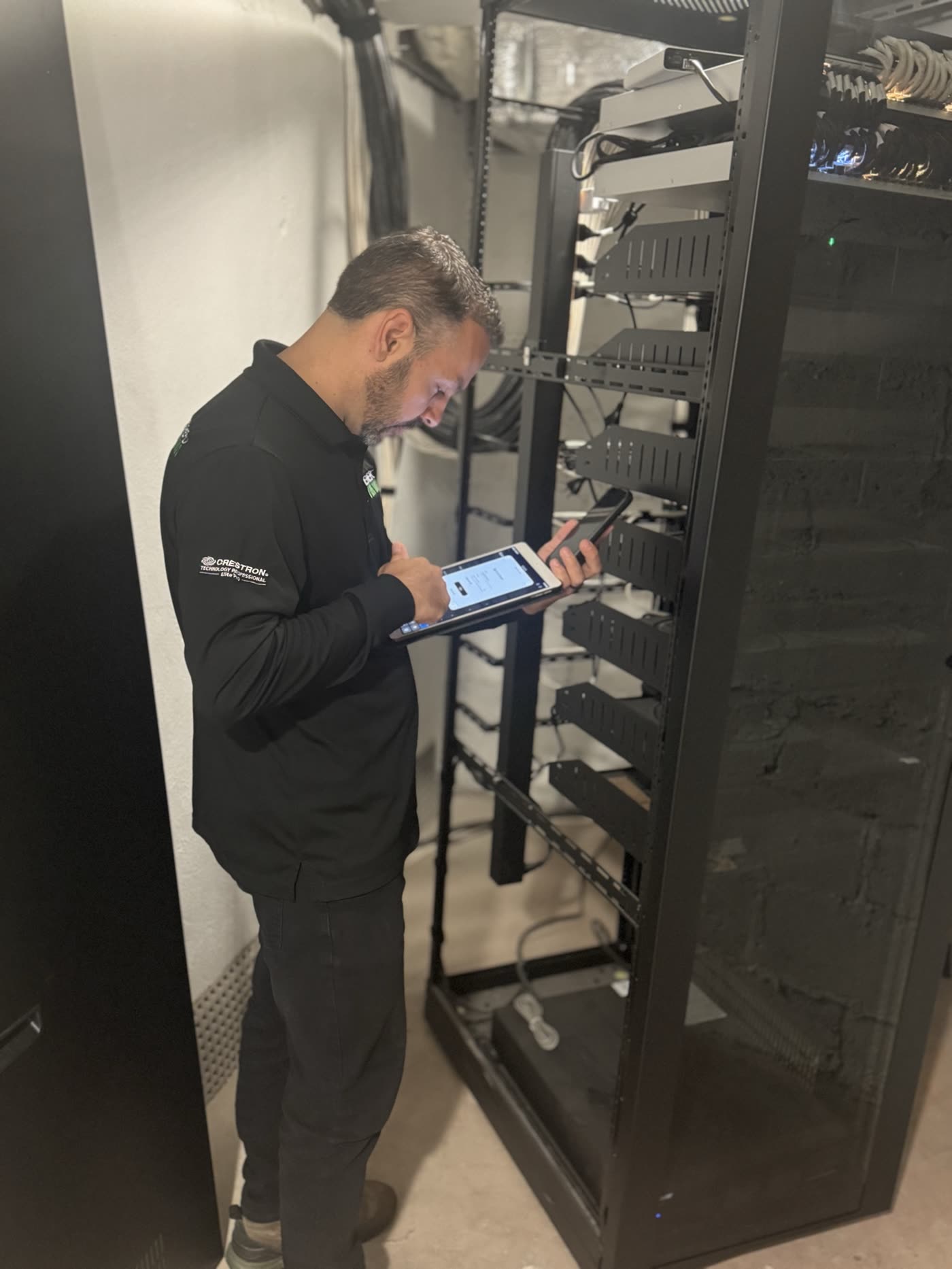 Restrepo Innovations technician commissioning the rack at 50 Summit medical office