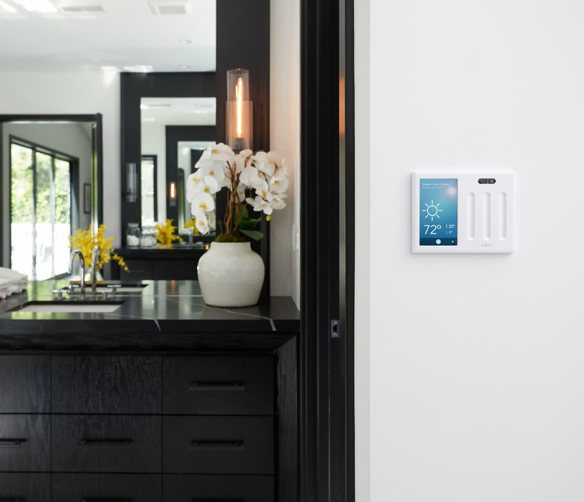 Brilliant smart home control panel installed in a finished kitchen interior