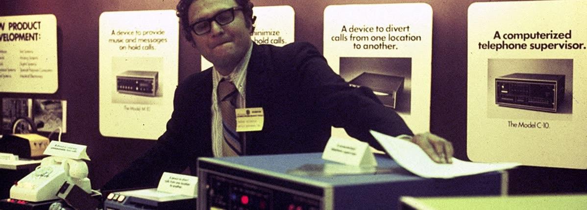 George Feldstein demonstrating early Crestron presentation control equipment during the company's history