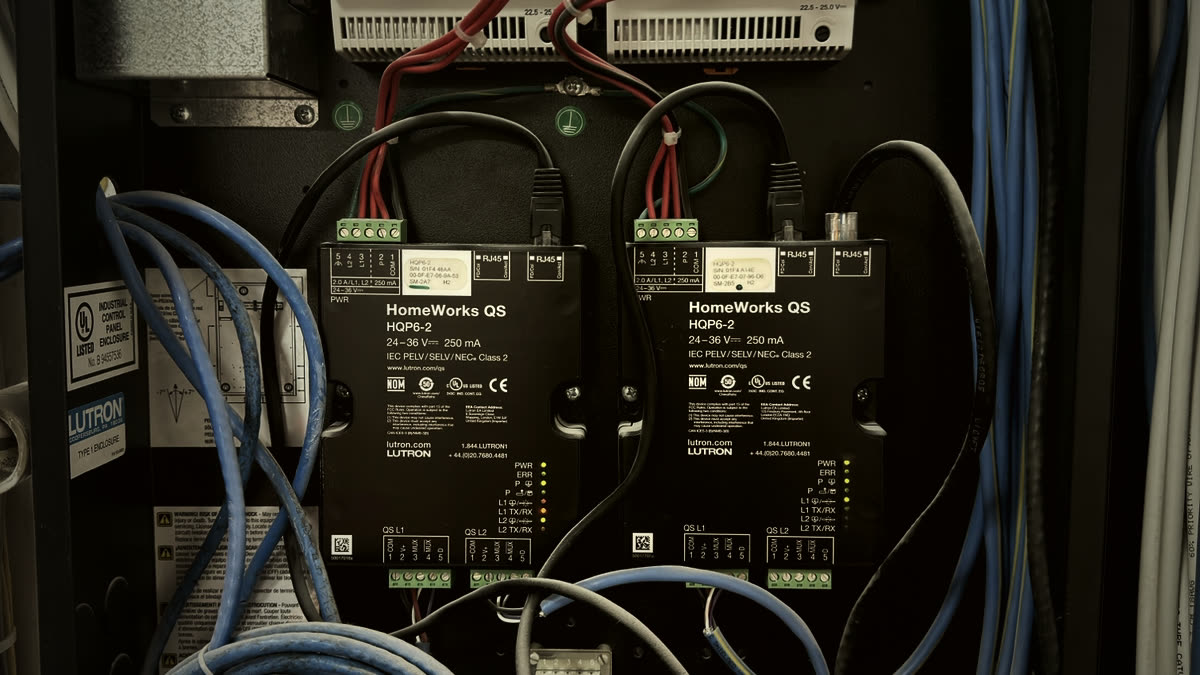 Two Lutron HomeWorks QS HQP6-2 processors with QSPS-DH-1-75 power supplies installed in a Restrepo Innovations head-end panel