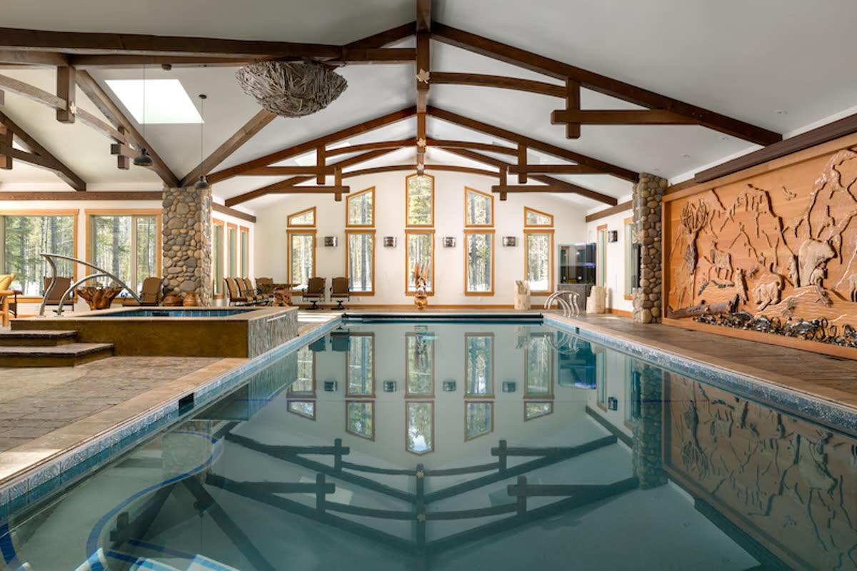 Screen Innovations projection screen used in a pool pavilion theater designed for group viewing