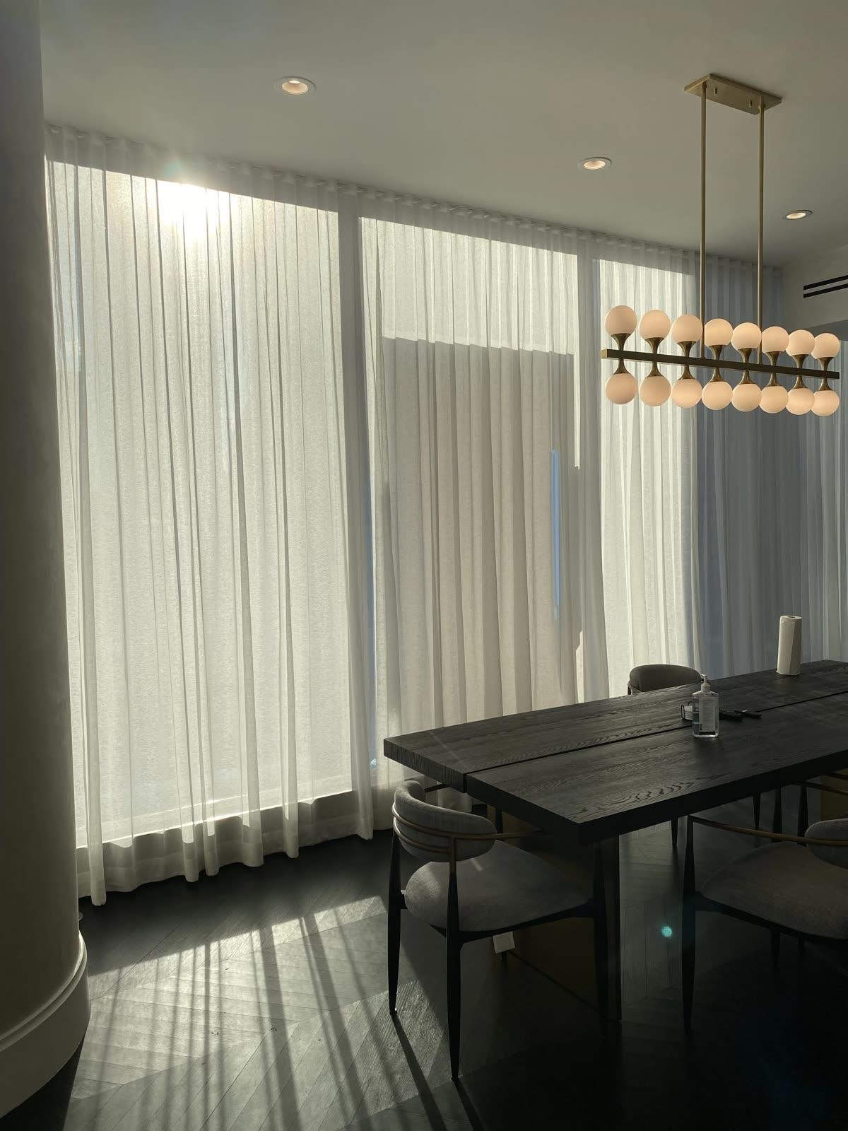Workroom Services ripplefold drapery installed across an office conference room