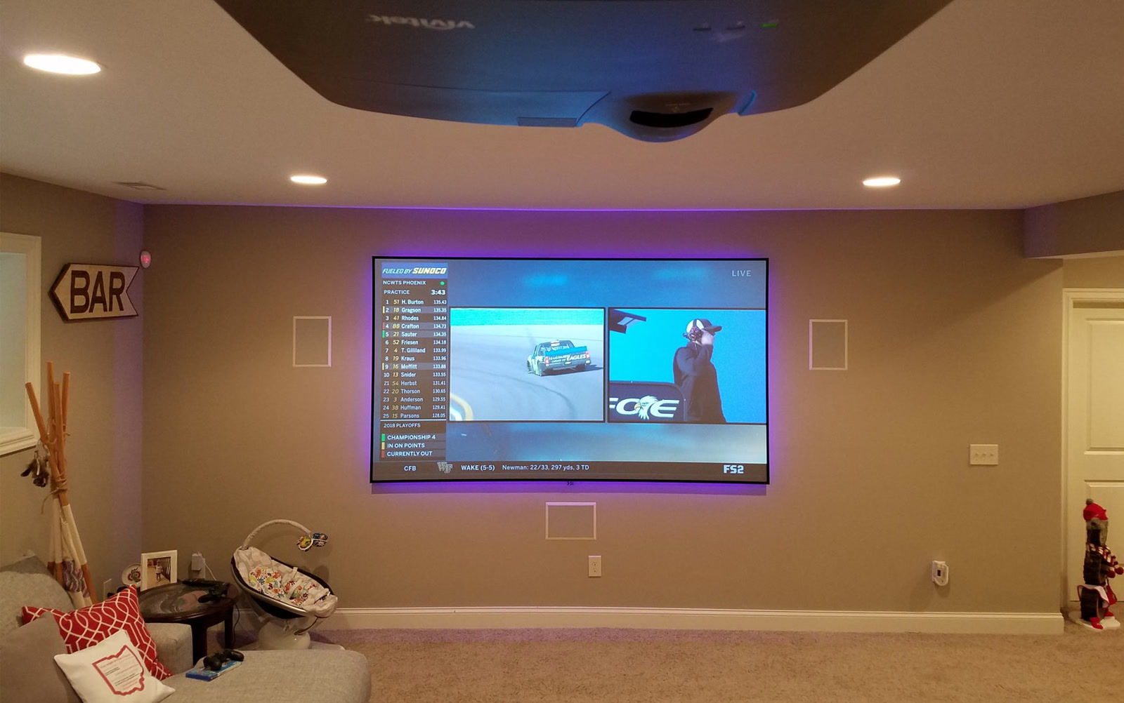 Screen Innovations Black Diamond ALR projection screen in a luxury great room